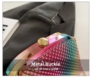 Detail of a rainbow metallic evening clutch bag featuring beadwork and a gold orb clasp
