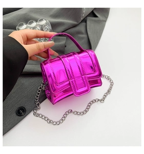 Close-up of mini metallic purple crossbody bag with glossy finish and silver chain strap