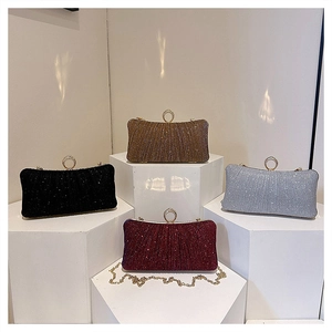 Glitter evening bags in four colors with pleated texture and rhinestone ring handles