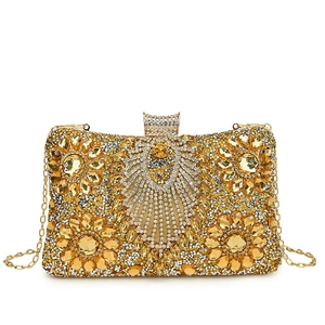 Golden evening clutch bag with rhinestone floral patterns and metal chain strap