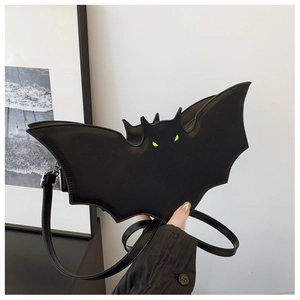 Detail of creative black bat crossbody bag with glowing green eyes for Halloween