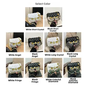 Detail view of owl flap bags with quilted patterns, crystal tassels and gold chains