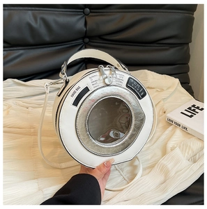 Close-up of creative washing machine shaped white leather handbag with silver metallic window