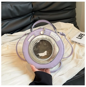 Macro detail of lavender washing machine shaped crossbody bag with a transparent round window