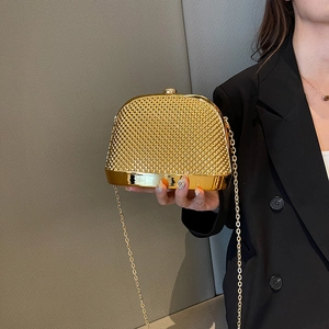 Elegant gold metallic weave evening clutch bag with chain strap and polished metal base