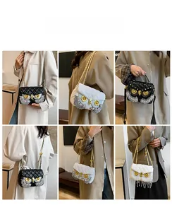 Quilted crossbody bag with owl design, rhinestone eyes and tassel seen on model