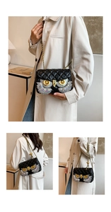 Detailed macro view of quilted owl shoulder bag featuring sparkling rhinestone eyes