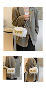 Detailed view of white quilted owl bag with crystal fringe tassels and chain strap