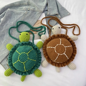 Cute handcrafted crochet turtle shoulder bag in green and brown knitted patterns