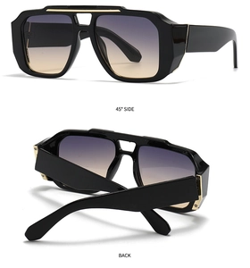 Detailansicht der großen Sonnenbrille mit Verlaufsgläsern und goldenen Metallakzenten