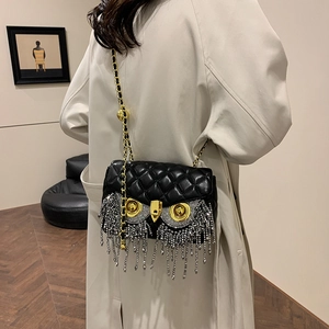 Black quilted crossbody bag with owl design and sparkling rhinestone fringe tassels