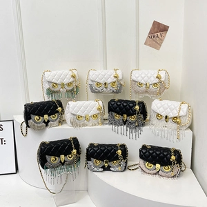 Quilted owl chain bag with tassels and rhinestones in black and white colors