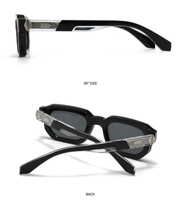 Détail de lunettes de soleil rétro noires avec inserts argentés sur branches transparentes
