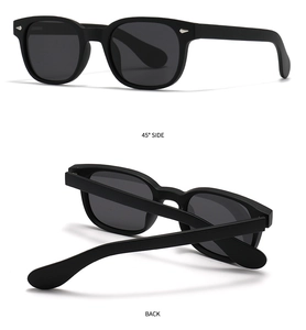 Gros plan sur des lunettes de soleil polarisées noir mat avec rivets et verres gris