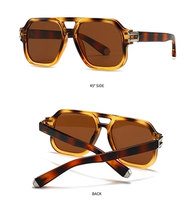 Detail view of tortoiseshell aviator sunglasses with double bridge and metal hinges
