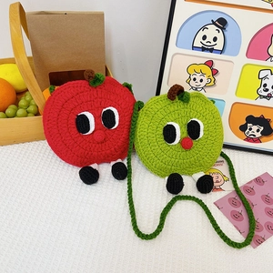 Cute knitted apple crossbody bags in red and green with quirky cartoon faces and strap