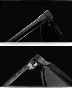 Detailed macro view of durable metal hinges and polished black frame of the sunglasses