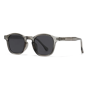 Modern vintage round polarized sunglasses with grey translucent frames and rivet detail