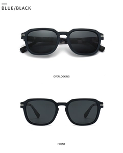 Detail of square oversized sunglasses with silver metal accents on wider temples