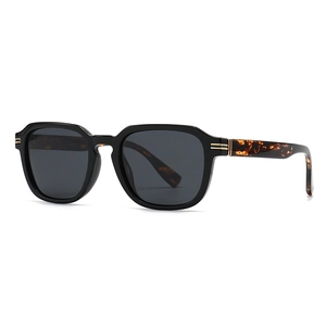 Black geometric sunglasses with tortoiseshell temples and gold hinge details on white background