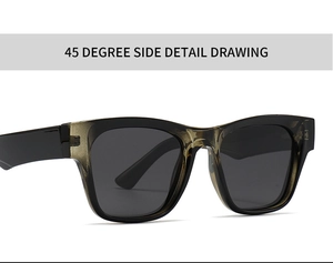 Détail de lunettes de soleil polarisées avec monture marron dégradé et branches noires à 45°
