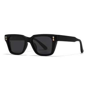 Chic polygonal black square sunglasses with gold rivet accents and dark grey lenses