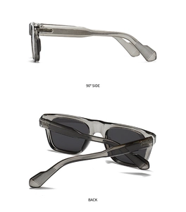 Detail of transparent smoke grey rectangular frame sunglasses with polarized dark lenses