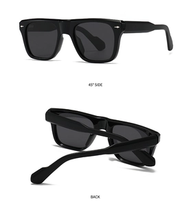 Close-up of black square polarized sunglasses with silver rivets and dual-angle views