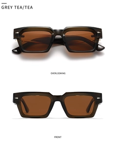 Close-up of grey tea acetate frame with silver arrow metal accents on retro sunglasses