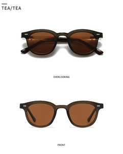 Détails macro des lunettes de soleil rondes polarisées rétro avec verres thé et monture brune