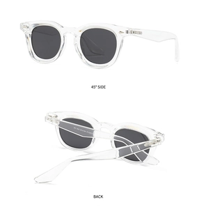 Macro detail of clear acetate sunglasses frame showing PS9013 model and grey lens