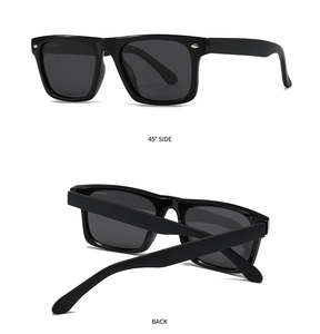 Detail view of black square sunglasses featuring silver studs and high-gloss frames