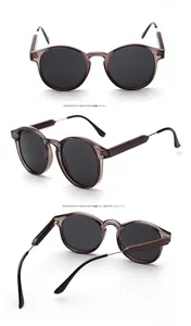 Three-angle view of transparent grey sunglasses with round frames and metal-spliced temples