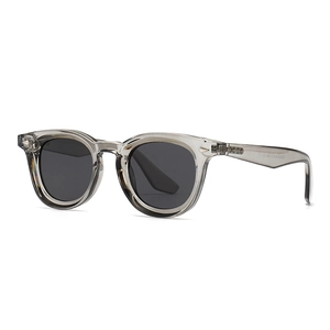 Classic polarized round sunglasses in translucent grey frame with diamond rivets