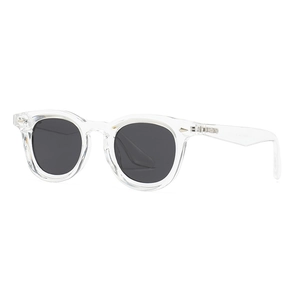Classic round sunglasses with transparent frames and dark polarized lenses on white background