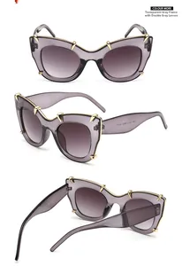 Three perspectives of cat-eye sunglasses with transparent grey frames and gold metal accents