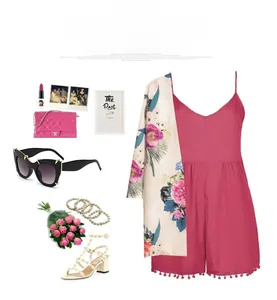 Flat lay of pink summer romper with floral cardigan and oversized black cat-eye sunglasses