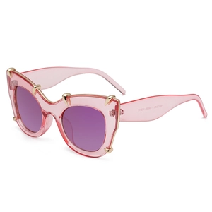 Pink translucent cat-eye sunglasses with purple lenses and gold claw metal accents