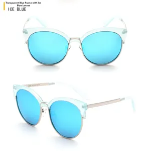 Detail view of transparent blue cat-eye frames with ice blue mirrored lenses and silver metal