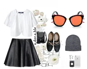 Flat lay of square sunglasses with red spike details and a complete trendy outfit set