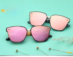 Detailed view of polarized sunglasses with rose gold and pink mirrored lenses in large frames