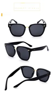 Detailed close-up of polarized TR sunglasses featuring black square frames and gold accents