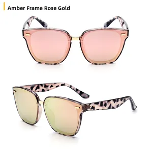 Close-up of tortoise shell frame sunglasses with rose gold lenses and metal bridge