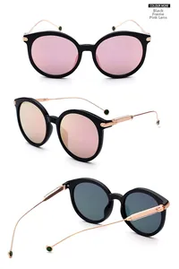 Detail view showing black cat-eye frame with pink lenses and rose gold metal temples