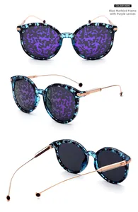 Detail of blue tortoise shell frame sunglasses with purple lenses and metal temples