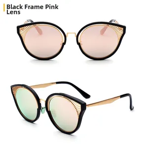 Dettaglio degli occhiali da sole cat-eye con montatura nera e lenti rosa sfumate