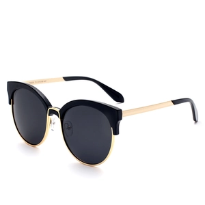 Women cat-eye sunglasses with black top frame and golden metal legs on white background
