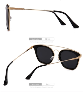 Detailansicht der runden Polarisationsbrille mit Goldrahmen und Bügelmarkierungen
