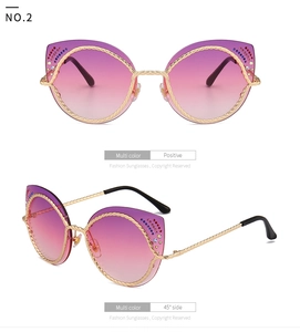 Detail van cat-eye zonnebril met gouden touwmontuur, verloopglazen en glanzende kristallen