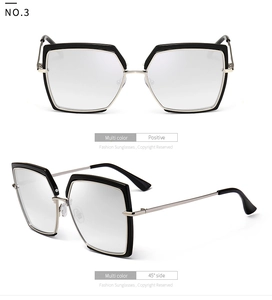 Macro detail of square oversize sunglasses with silver metal temples and black frame